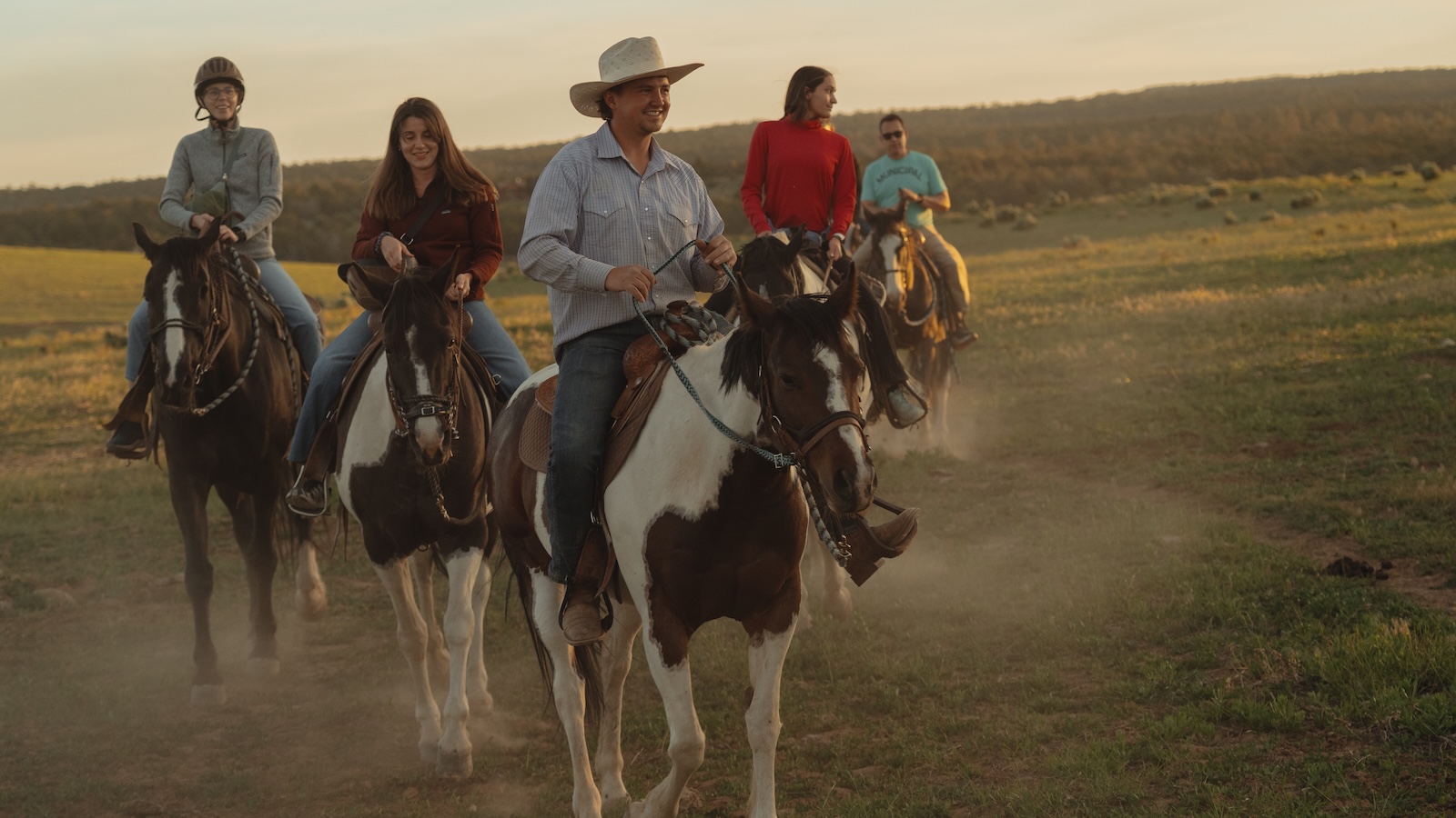 Horseback riders on open ranch trails near Zion